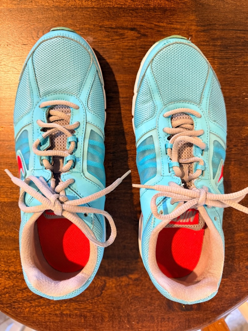 Nike Gray Sneakers with Red Insoles and Lace-Up Design